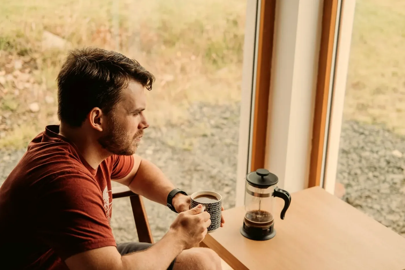 A man relaxing at home with a mug